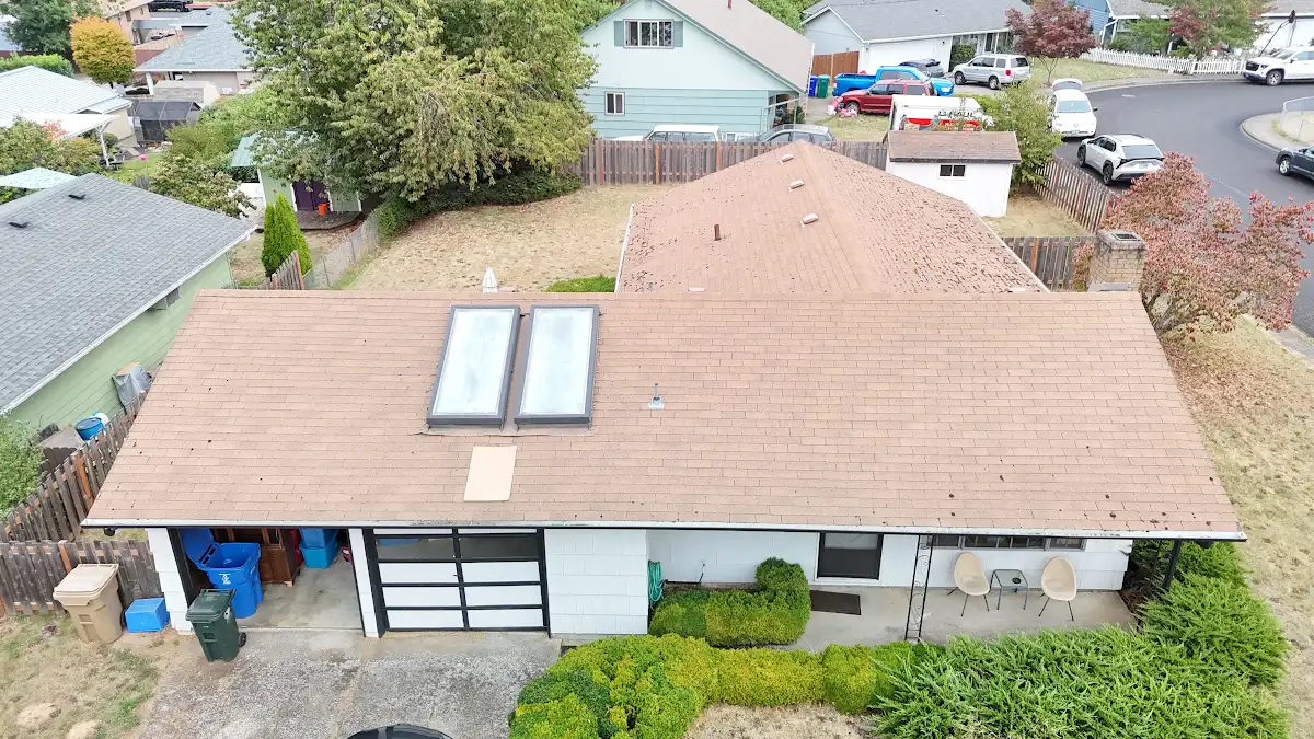 Original roof and non-working solar water heater panels on a ranch home in Aldercrest, Milwaukie, OR