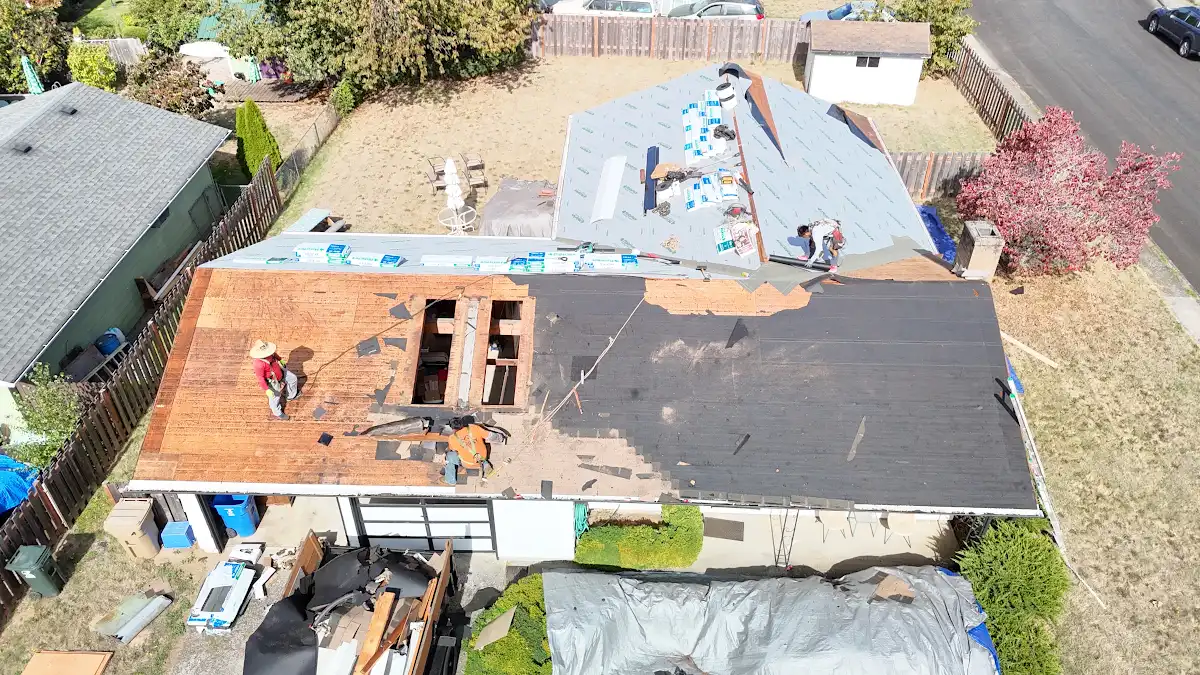 Roof torn off with the old solar water heater removed and rotted plywood exposed in Aldercrest, Milwaukie, OR