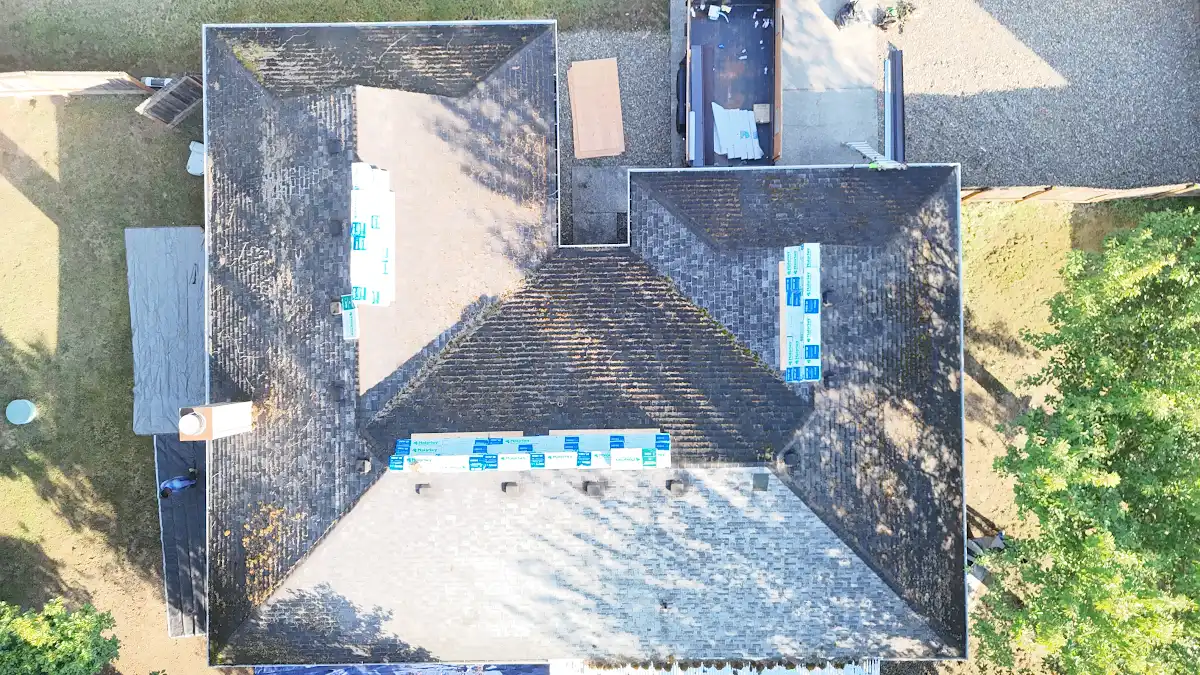 Overhead view of roofing materials staged on the old roof in Green Arbor Village, La Center, WA