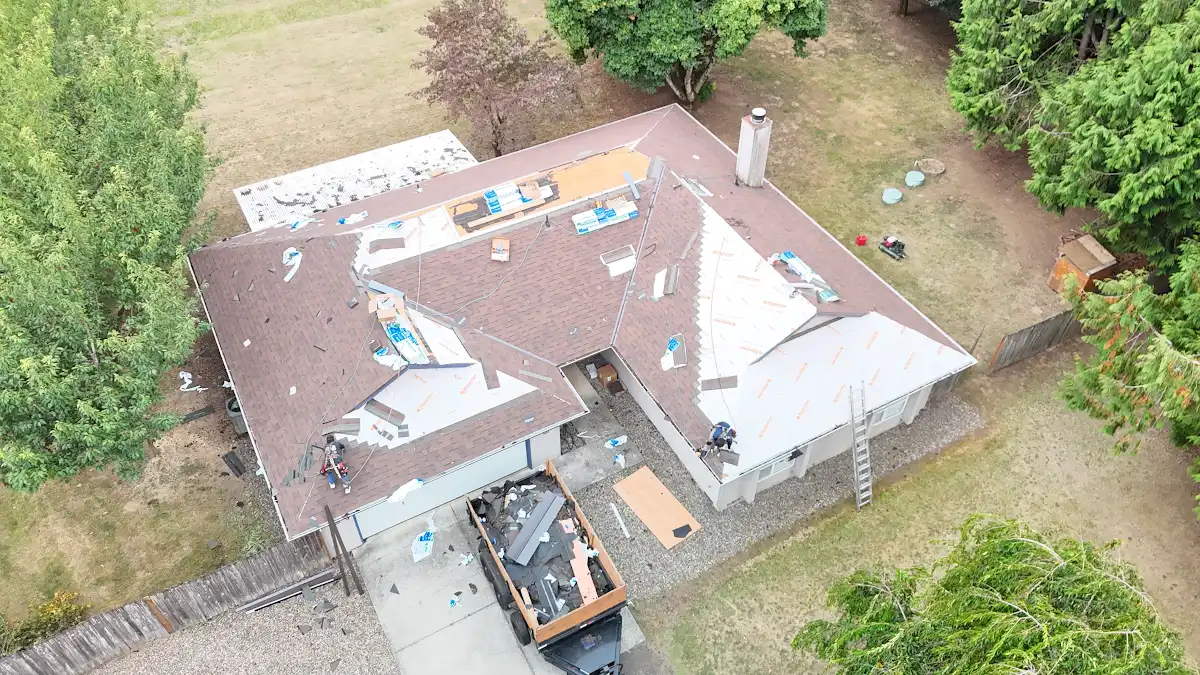 Crew installing Malarkey permeable underlayment on a home in Green Arbor Village, La Center, WA