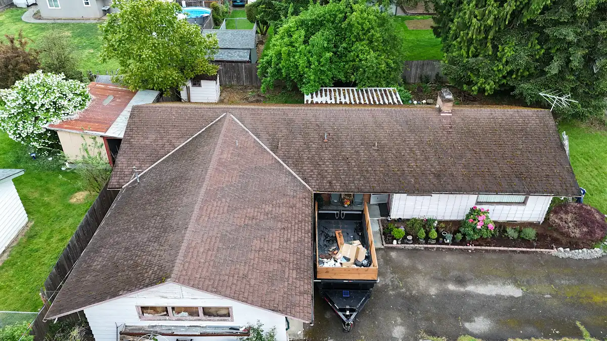 Old roof and dumpster staged for tear-off on a home in Hidden Terrace, Camas, WA