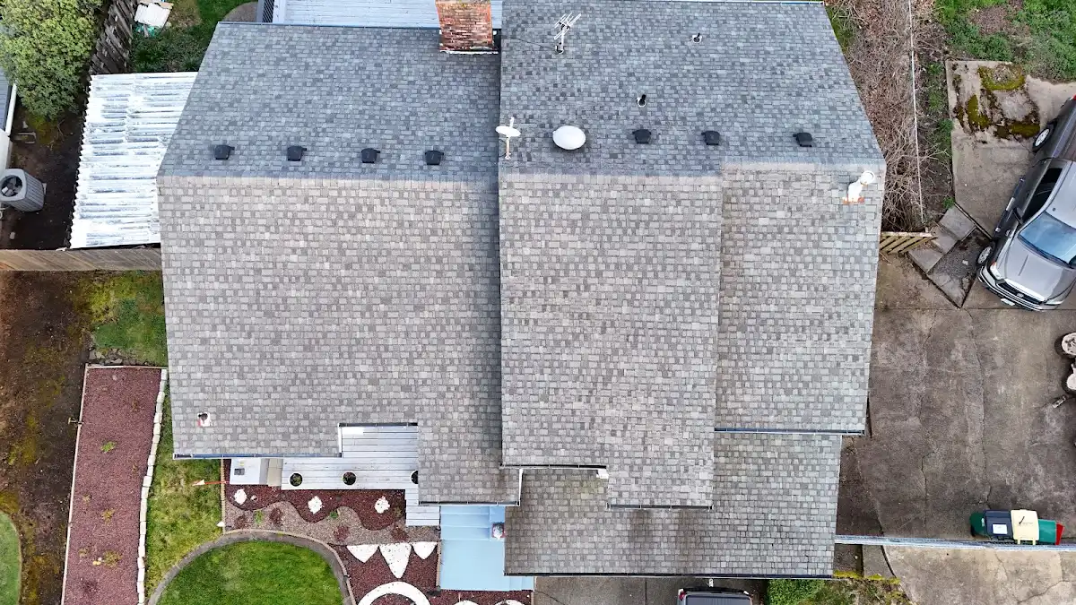Overhead view of an end-of-life roof with old satellite dishes on a home in Troutdale, OR