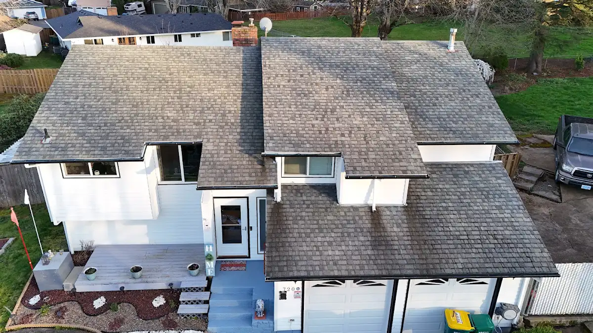 Aerial view of the original roof and sagging gutters on a split-level home in Troutdale, OR